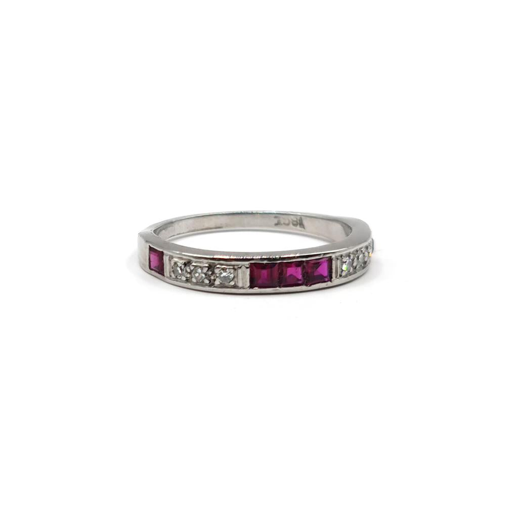 18ct white gold ruby and diamond half eternity ring with alternating stones, elegant and sparkling jewelry design.