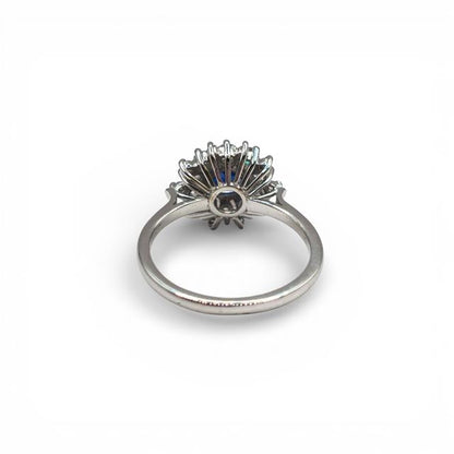 18ct white gold sapphire and diamond ring with elegant design, showcasing vibrant blue sapphire and sparkling diamonds.