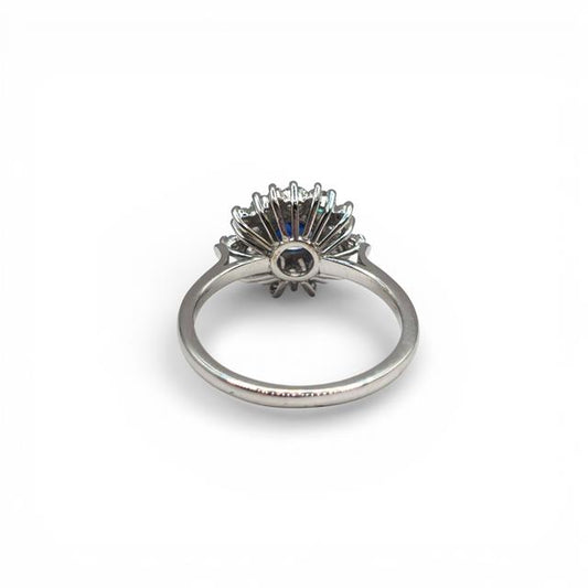 18ct white gold sapphire and diamond ring with elegant design, showcasing vibrant blue sapphire and sparkling diamonds.