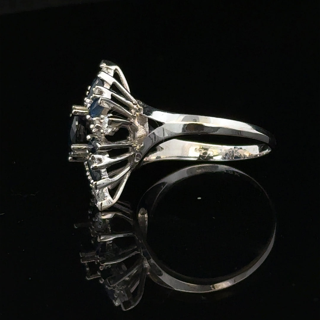 18ct white gold sapphire and diamond ring in size N1/2, featuring a stunning gemstone design with elegant craftsmanship.