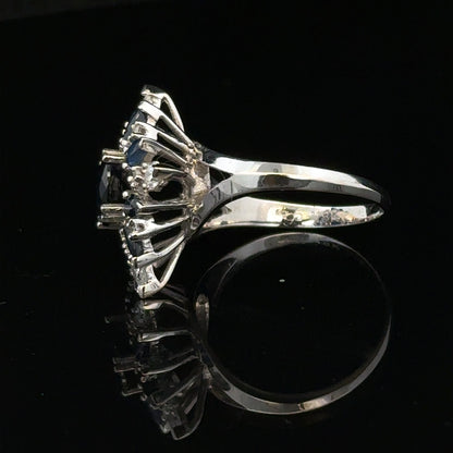18ct white gold sapphire and diamond ring in size N1/2, featuring a stunning gemstone design with elegant craftsmanship.