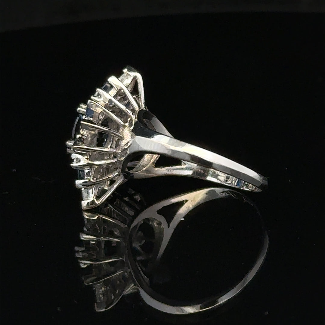 18ct white gold sapphire and diamond ring in size N1/2, featuring a sparkling blue sapphire and white diamond accents.