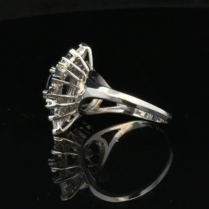 18ct white gold sapphire and diamond ring in size N1/2, featuring a sparkling blue sapphire and white diamond accents.