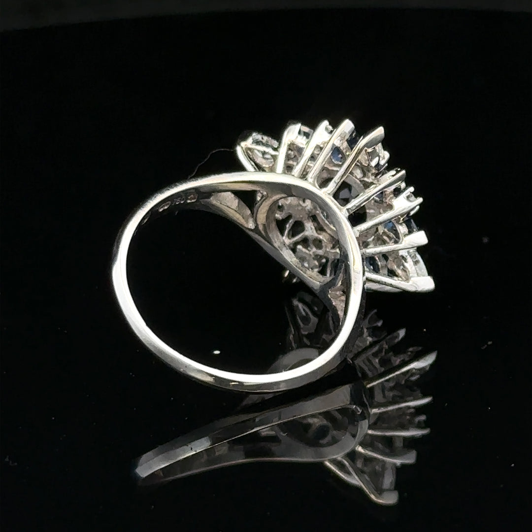 18ct white gold sapphire and diamond ring, size N1/2, showcasing a sparkling central sapphire surrounded by diamonds.