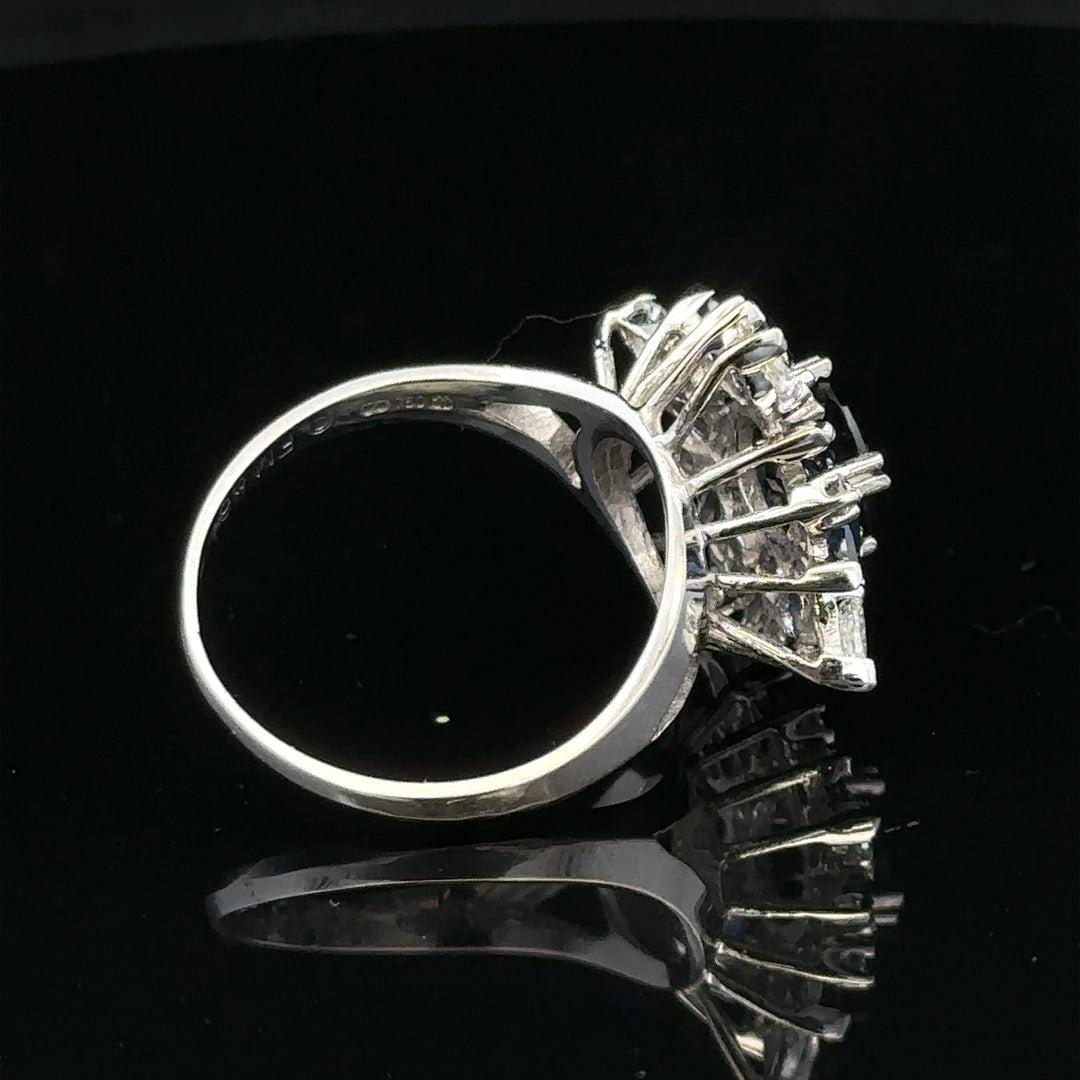 18ct white gold sapphire and diamond ring, size N1/2, featuring a central sapphire and sparkling diamonds.