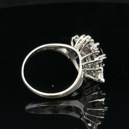 18ct white gold sapphire and diamond ring, size N1/2, featuring a central sapphire and sparkling diamonds.