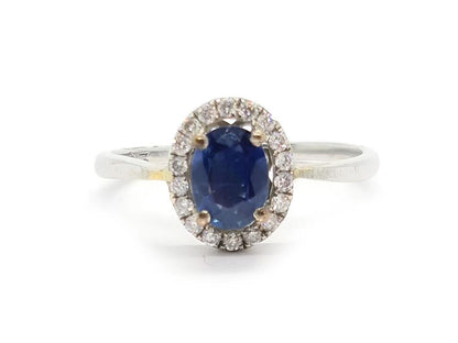 18ct white gold sapphire and diamond ring featuring a central sapphire gemstone and sparkling diamonds.