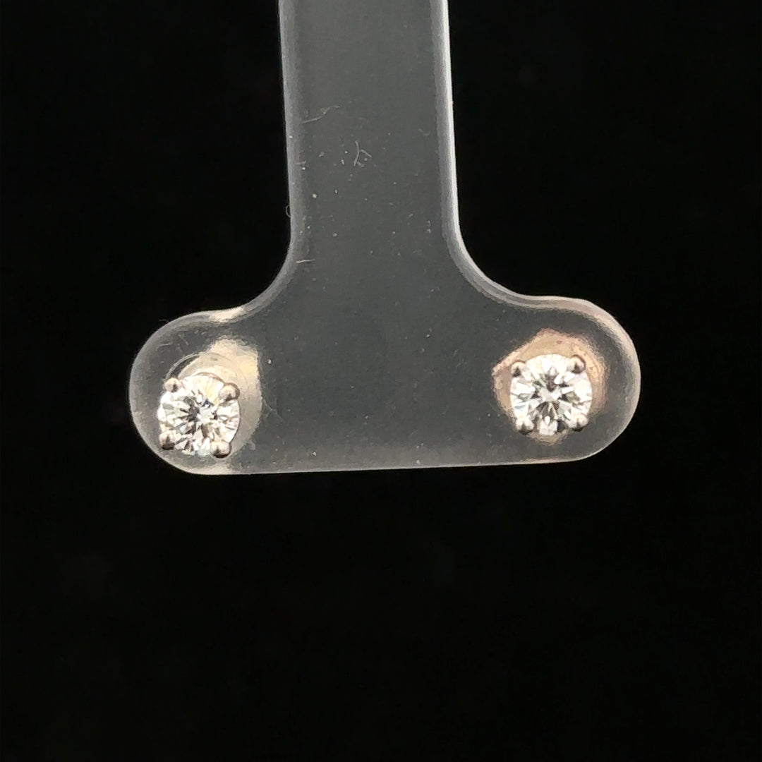 18ct white gold diamond stud earrings with 0.40 carat diamonds, featuring a classic and elegant jewelry design.