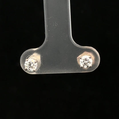 18ct white gold diamond stud earrings with 0.40 carat diamonds, featuring a classic and elegant jewelry design.