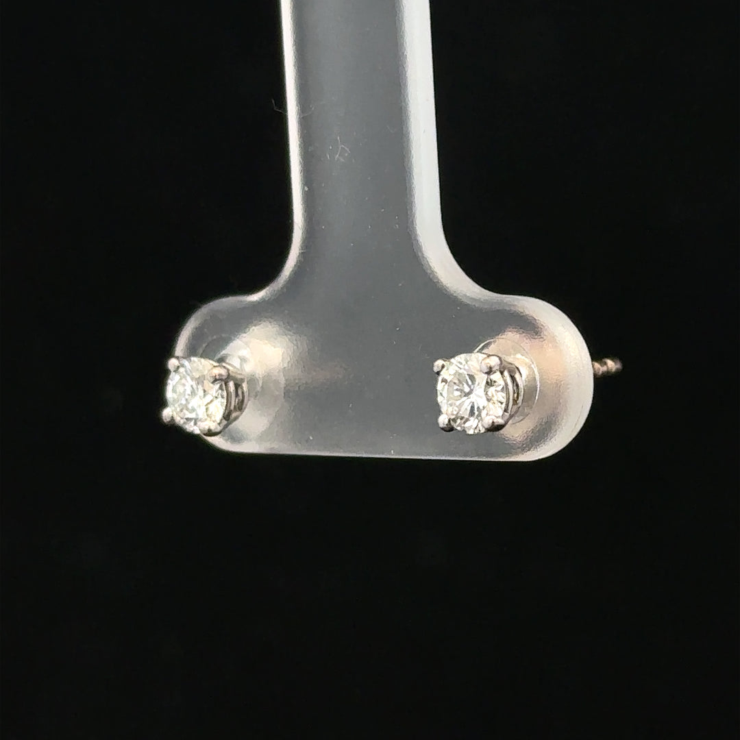 18ct white gold diamond stud earrings with 0.40 carat total weight featuring sparkling diamonds and a classic design.