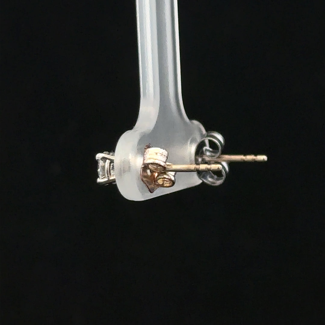 18ct white gold diamond stud earrings with 0.40 carat diamonds, featuring classic, elegant jewelry design.