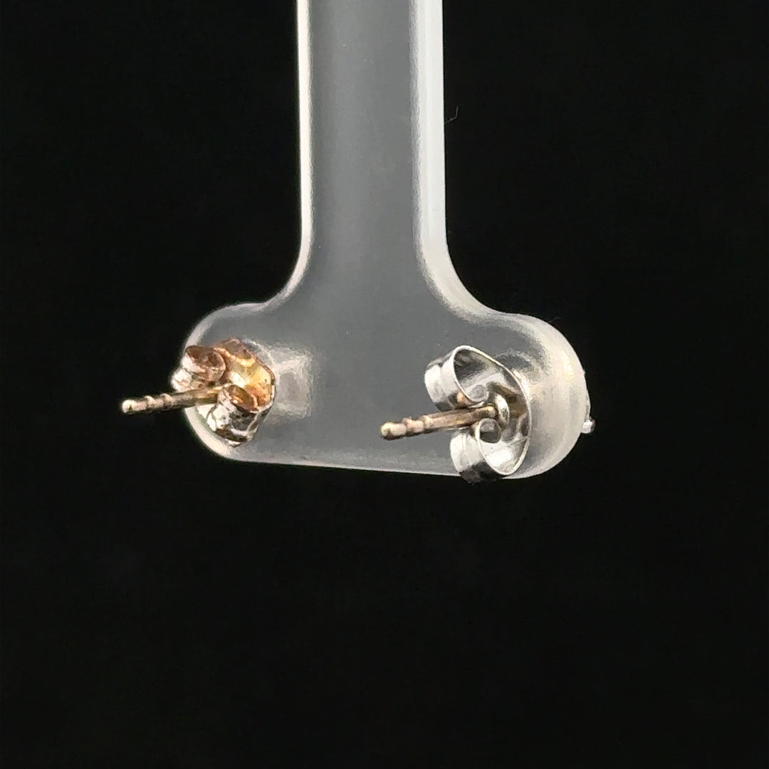 18ct white gold diamond stud earrings with 0.40 carat total weight, featuring sparkling round diamonds on a classic setting.