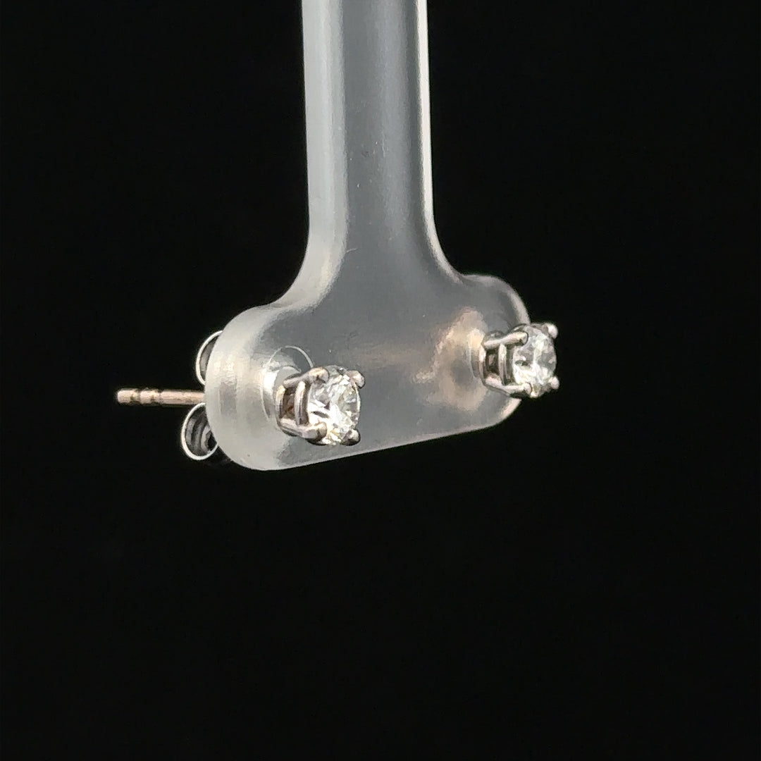 18ct white gold stud earrings with 0.40 carat diamonds, featuring classic design and sparkling diamond accents.