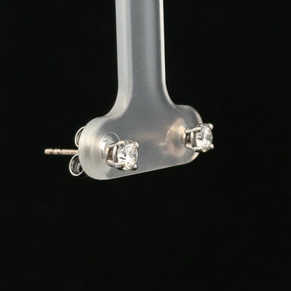 18ct white gold stud earrings with 0.40 carat diamonds, featuring classic design and sparkling diamond accents.