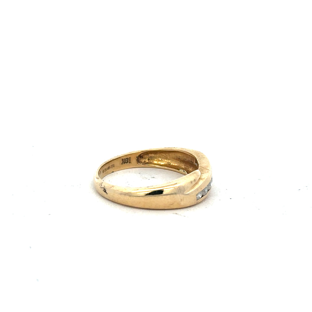 18ct yellow gold diamond ring with 1/4 carat diamond, size Q, showcasing a sleek band with sparkling stones.
