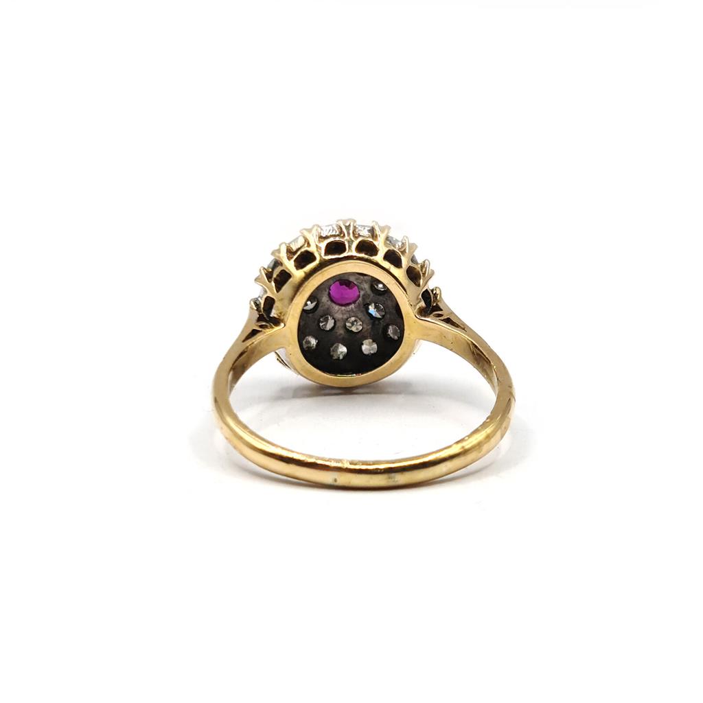 18ct yellow gold ruby and diamond cluster ring, size Q, featuring a 0.15 carat ruby and 0.60 carat diamonds.
