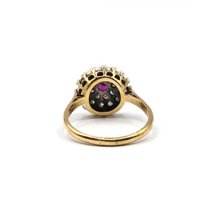 18ct yellow gold ruby and diamond cluster ring, size Q, featuring a 0.15 carat ruby and 0.60 carat diamonds.