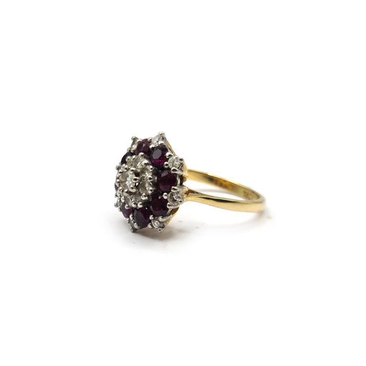 18ct yellow gold ring with 0.25ct ruby and 0.90ct diamond, featuring a classic design and sparkling gemstones.