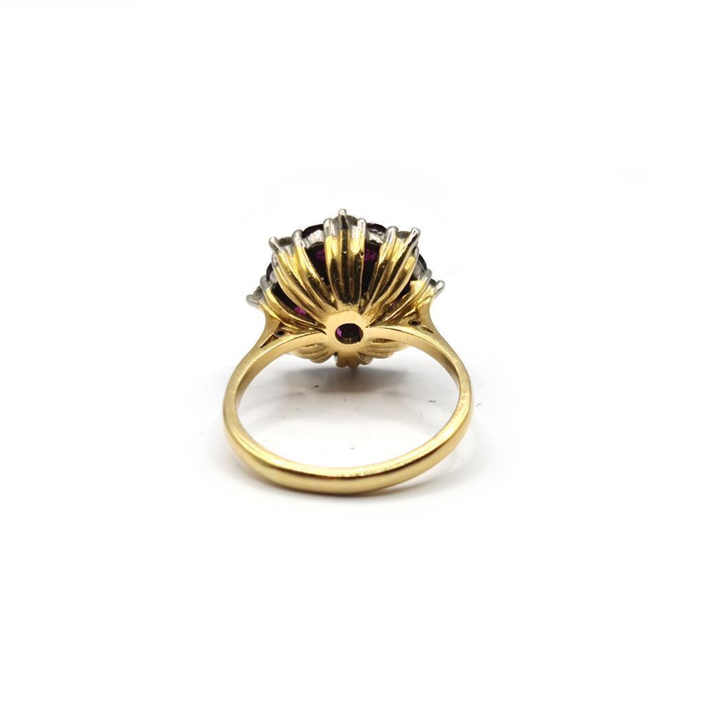 18ct yellow gold ring with 0.25 carat ruby and 0.90 carat diamond, showcasing a elegant gemstone design.