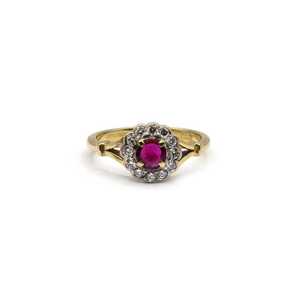18ct yellow gold ring featuring a 0.33 carat ruby and 1/4 carat diamond, showcasing a stylish jewelry design.
