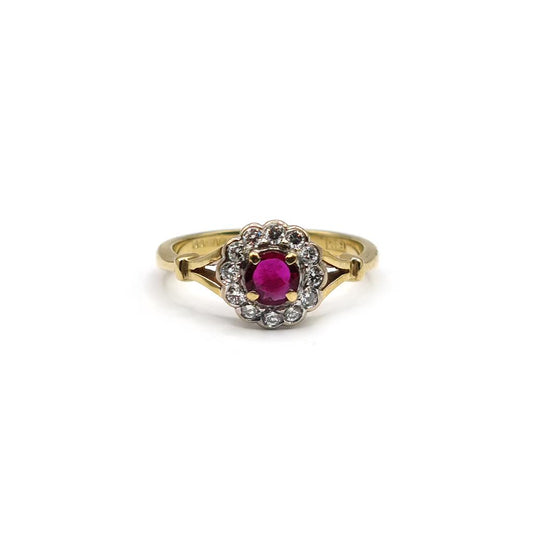 18ct yellow gold ring featuring a 0.33 carat ruby and 1/4 carat diamond, showcasing a stylish jewelry design.