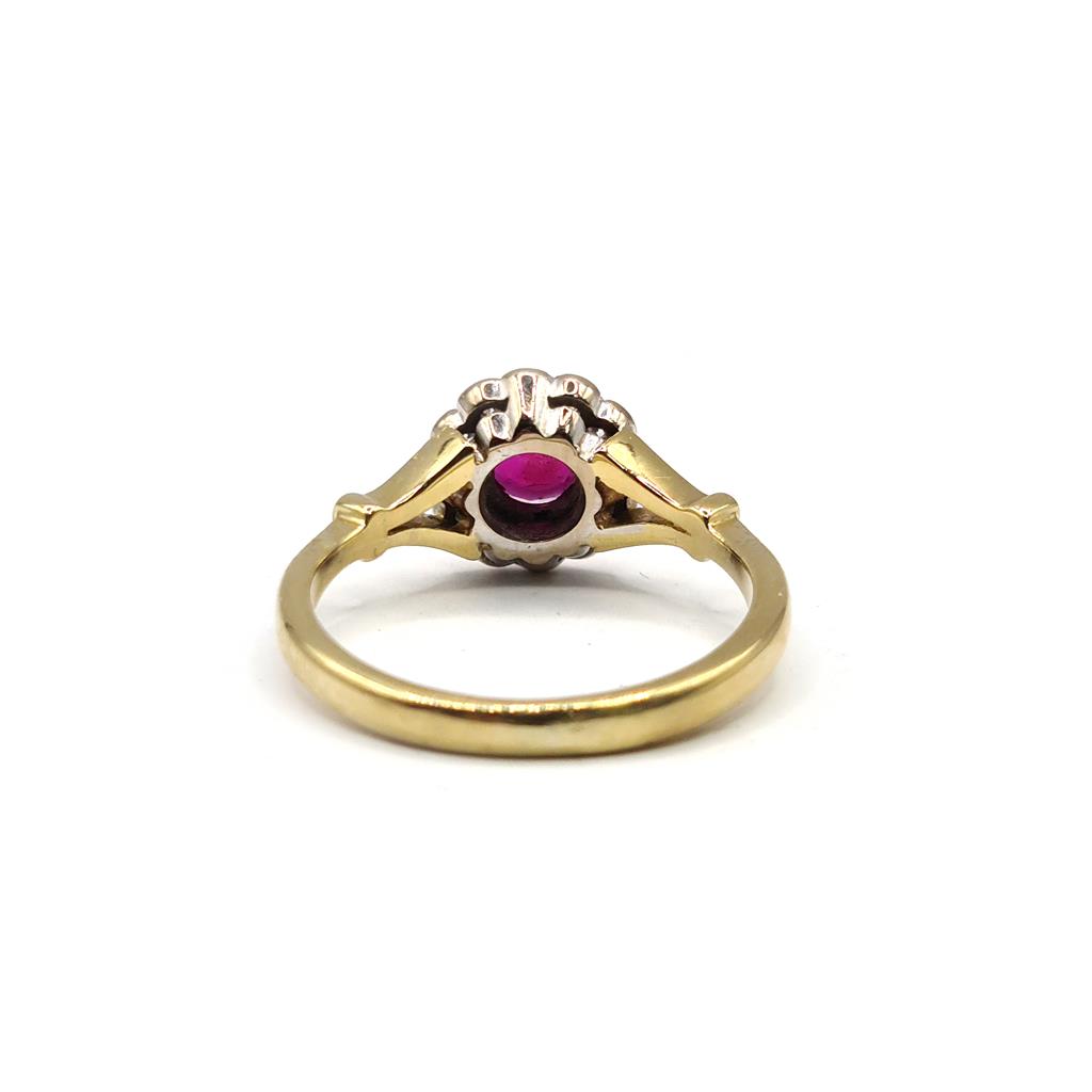 18ct yellow gold ring featuring a 0.33 carat ruby and 1/4 carat diamond, elegant jewelry with vibrant gemstones and gold setting.