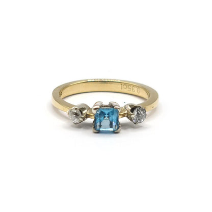 18ct yellow gold ring with a 0.35 carat topaz and 0.14 carat diamond accents, elegant jewelry design.
