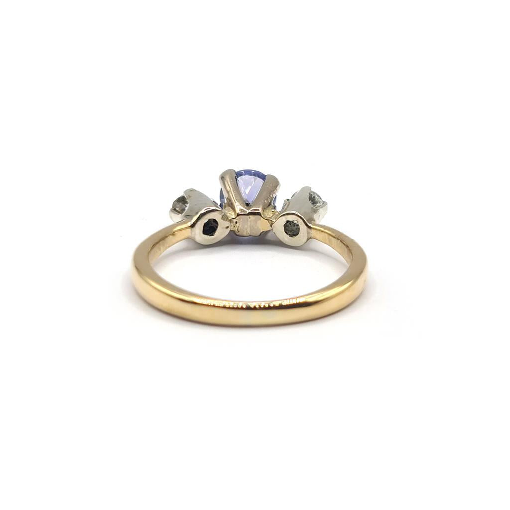 18ct yellow gold ring with a 0.40 carat tanzanite gemstone and 0.20 carat diamond accents, showcasing elegant jewelry design.