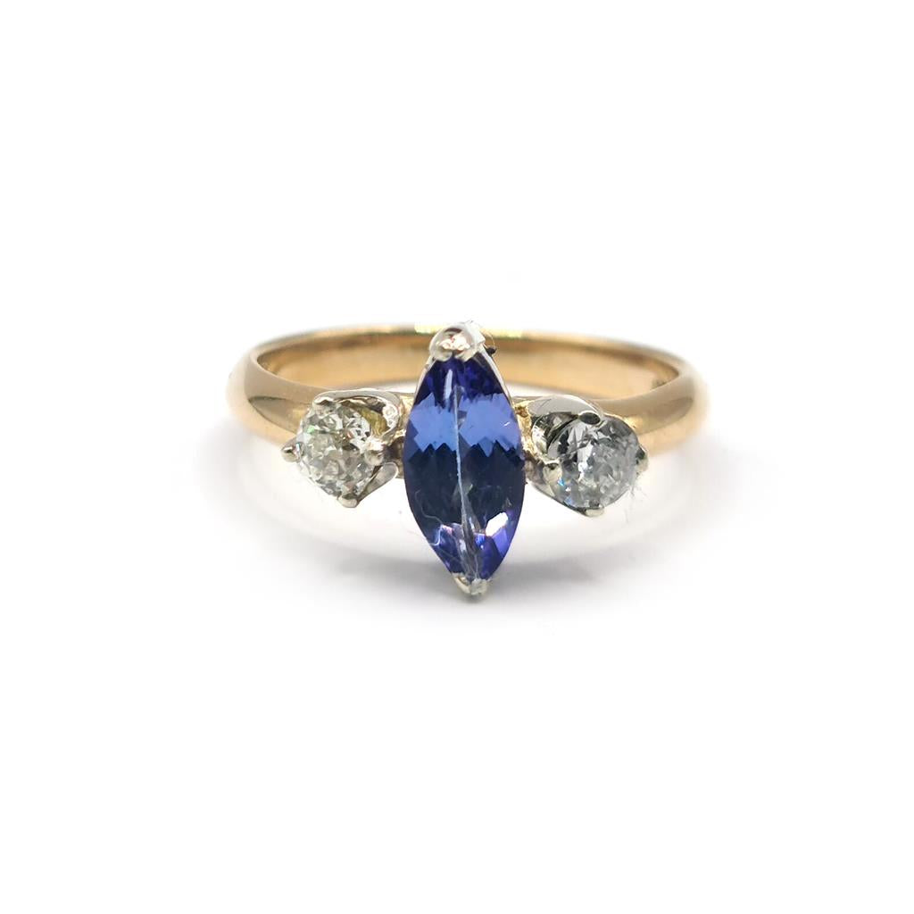 18ct yellow gold ring featuring a 0.50 carat tanzanite gemstone and 0.30 carat diamonds, elegant jewelry piece.