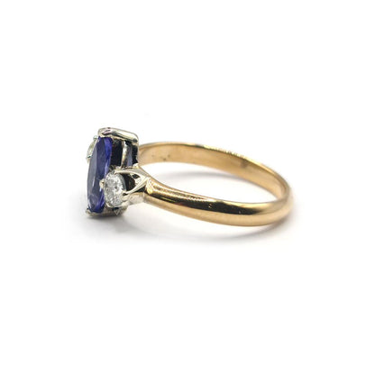 18ct yellow gold ring featuring a 0.50 carat tanzanite and 0.30 carat diamond accent, elegant jewelry piece.