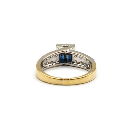 18ct yellow gold sapphire and diamond ring with 0.60 carat sapphire and 0.70 carat diamonds, size N, shown on a white background