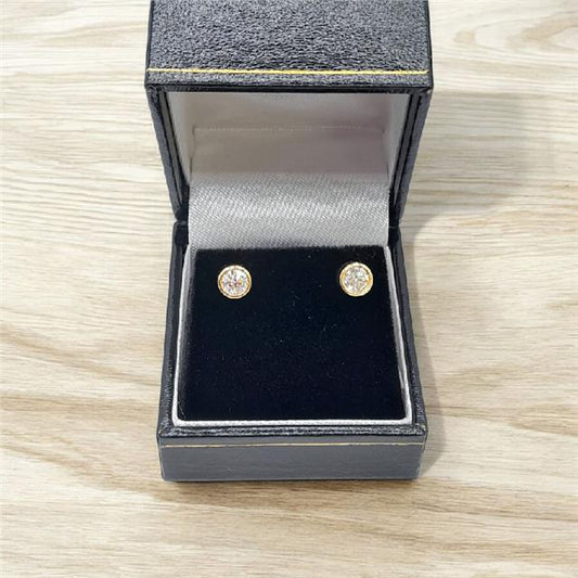 18ct yellow gold lab diamond earrings with 0.84ct, color E, VS1 clarity, featuring elegant gemstone settings.