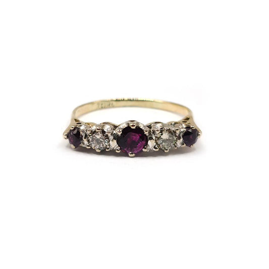 18ct yellow gold ring with a 0.85 carat ruby and 0.44 carat diamond accents, elegant jewelry design.