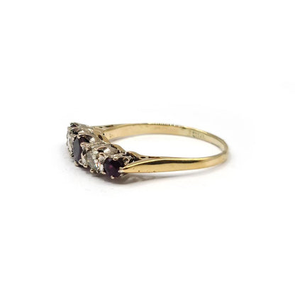 18ct yellow gold ring with 0.85 carat ruby and 0.44 carat diamond accents, showcased on a white background.