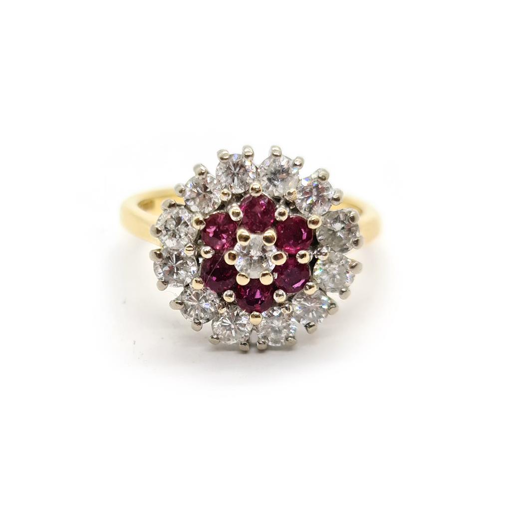 18ct yellow gold ring with 1.18ct diamonds and 0.36ct rubies, size K, featuring a classic design.