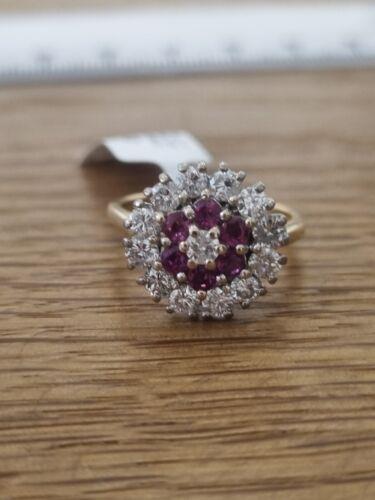 18ct yellow gold ring featuring 1.18ct diamonds and 0.36ct rubies, size K, with a classic and elegant design.