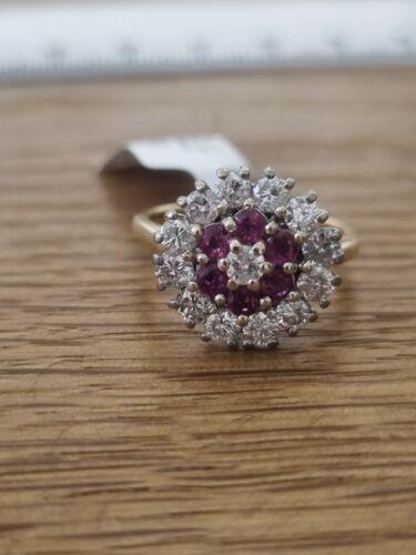 18ct yellow gold ring with 1.18ct diamonds and 0.36ct rubies, size K, featuring elegant gemstone accents.