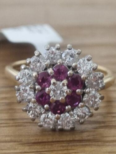 18ct yellow gold ring featuring 1.18ct diamond and 0.36ct ruby, size K, with intricate band design.