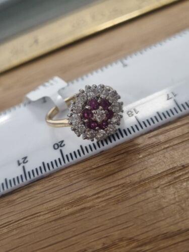 18ct yellow gold ring with 1.18ct diamonds and 0.36ct rubies, size K, featuring elegant gemstone accents and a polished band.