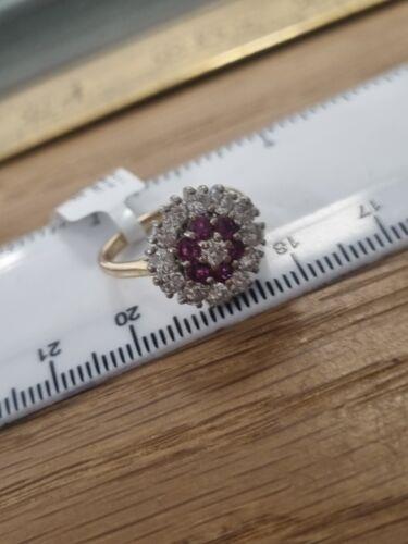 18ct yellow gold ring featuring 1.18ct diamonds and 0.36ct rubies, size K, with a classic and elegant design.