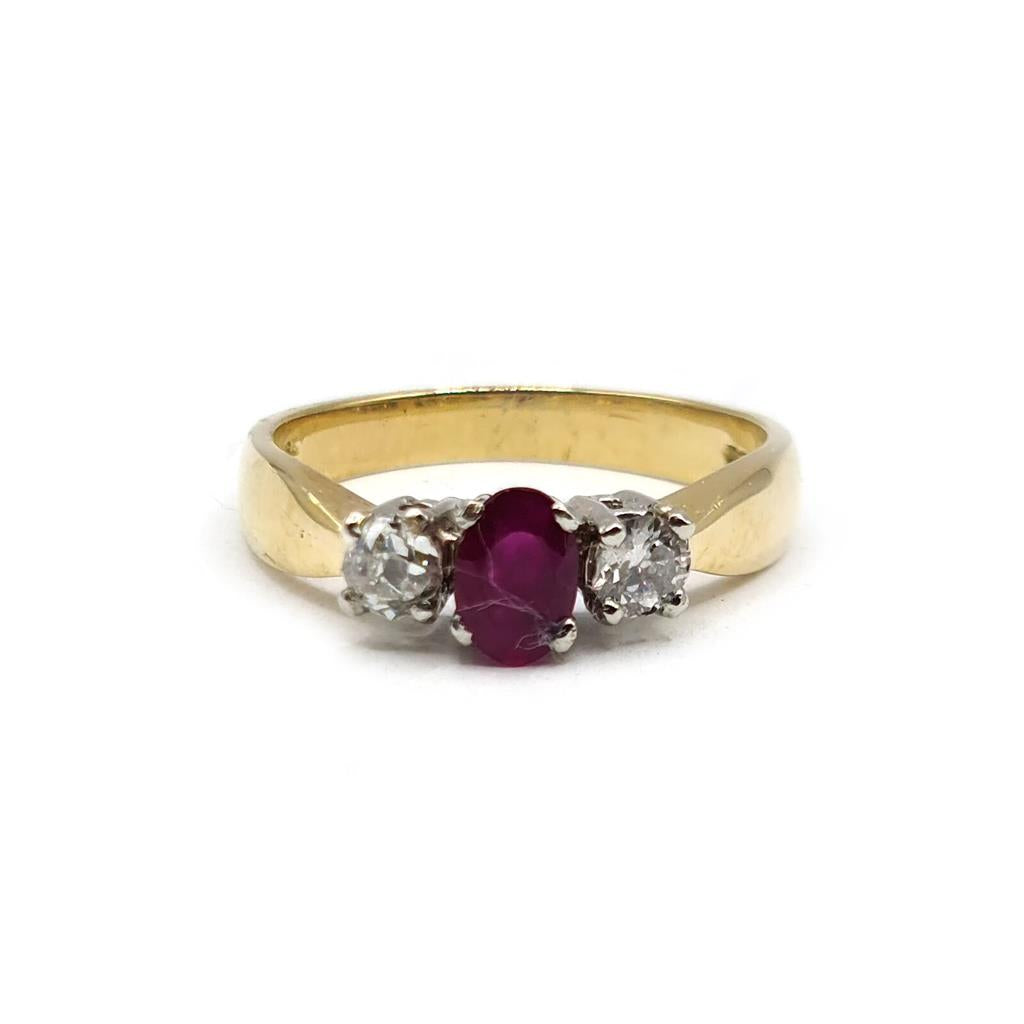 18ct yellow gold ring featuring a 1/2 carat ruby and 0.30 carat diamond, showcasing a luxurious and elegant design.