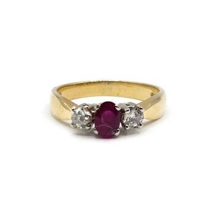 18ct yellow gold ring featuring a 1/2 carat ruby and 0.30 carat diamond, showcasing a luxurious and elegant design.