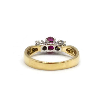 18ct yellow gold ring featuring a 1/2 carat ruby and 0.30 carat diamond, showcasing elegant gemstone details and gold setting.