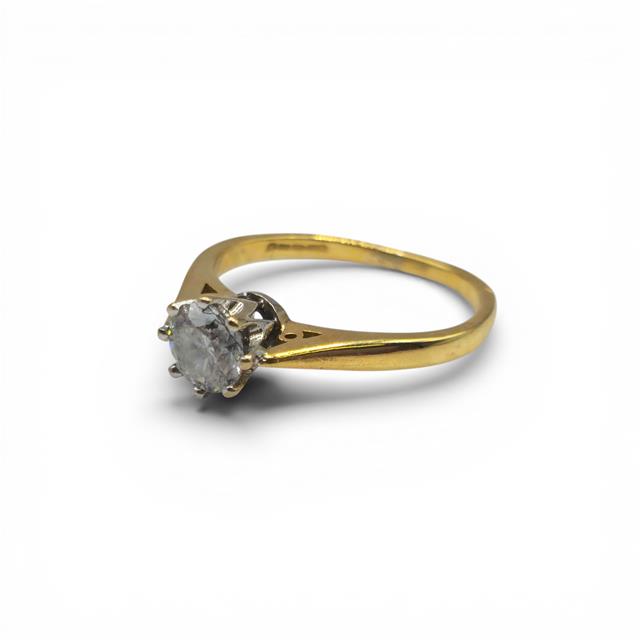 18ct yellow gold diamond ring with 1/2 carat total weight, featuring sparkling diamonds and a sleek, elegant design.