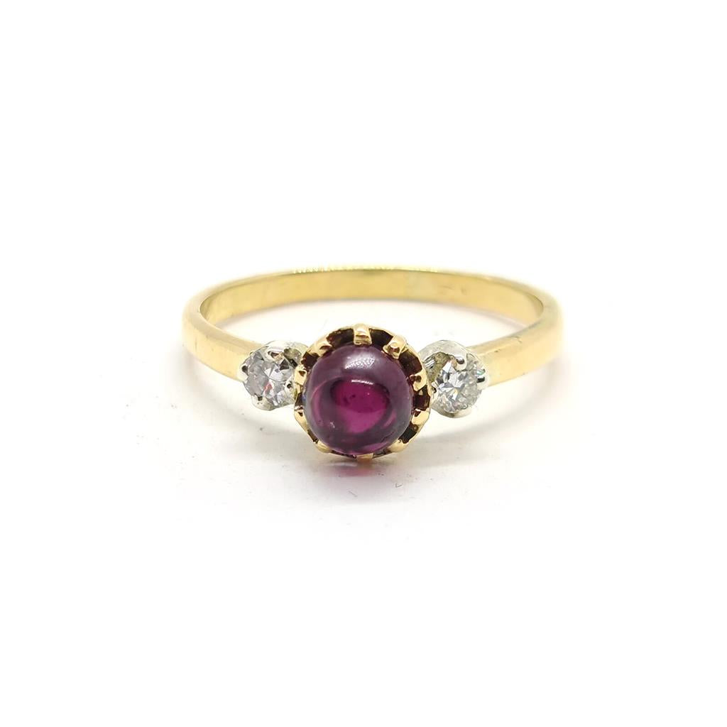 18ct yellow gold garnet and diamond ring featuring a 1.45 carat garnet and 0.30 carat diamonds, elegant jewelry piece.