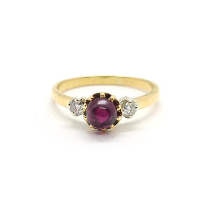 18ct yellow gold garnet and diamond ring featuring a 1.45 carat garnet and 0.30 carat diamonds, elegant jewelry piece.