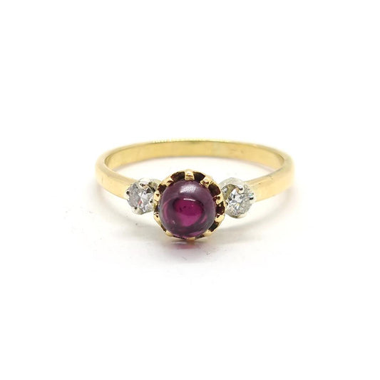 18ct yellow gold garnet and diamond ring featuring a 1.45 carat garnet and 0.30 carat diamonds, elegant jewelry piece.