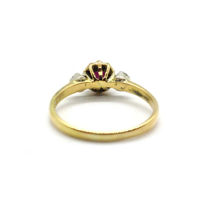 18ct yellow gold ring with a 1.45 carat garnet centerpiece and 0.30 carat diamonds, elegant unbranded jewelry design.
