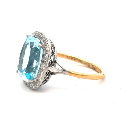 18ct yellow gold ring with a 10.70 carat topaz and 0.40 carat diamond accents, size R, unbranded jewelry.