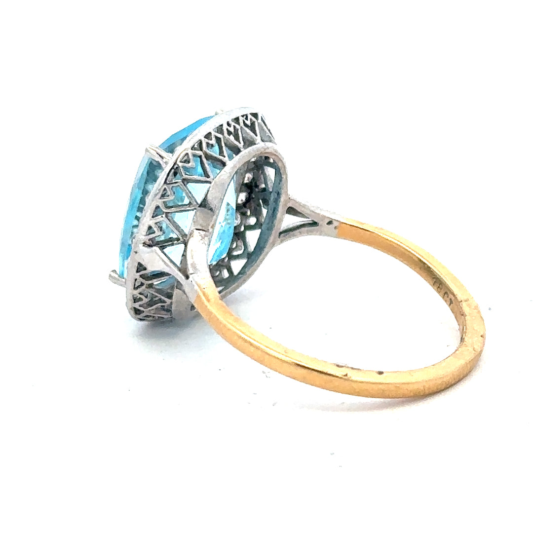 18ct yellow gold ring featuring a 10.70ct topaz and 0.40ct diamonds, size R, elegant jewelry with intricate design.
